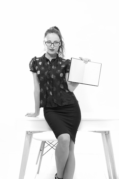 Show the example elegant woman hold notebook copy space businesswoman at workplace confident lady boss girl show book sexy student in classroom back to school female teacher wear glasses