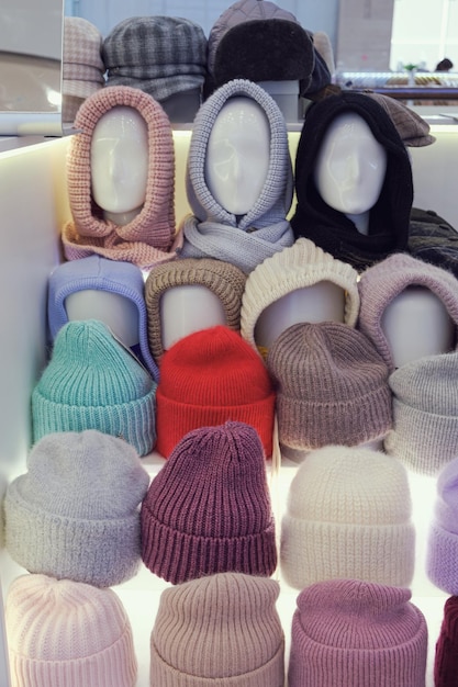 Showcase of trade tent with variety of women's hats knitted hats scarves hats