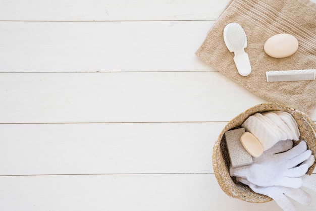 Shower accessories arranged on white wooden desk