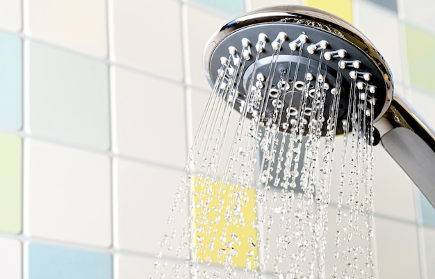 Shower head with flowing water bathroom in pastel colors