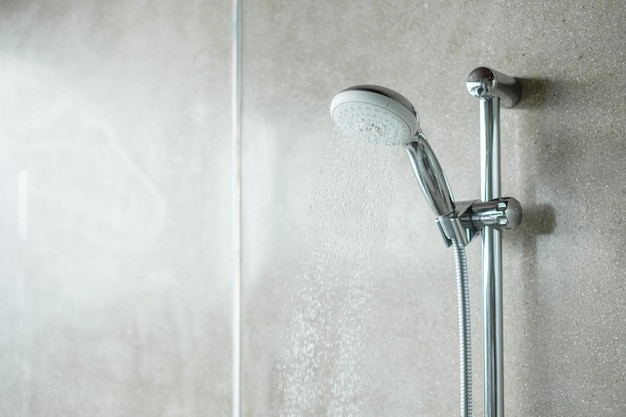 Shower head with wall background in modern bathroom