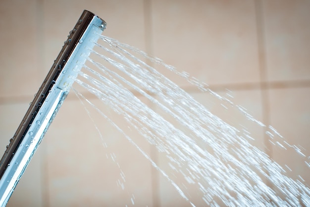 Shower head with wall background in modern bathroom