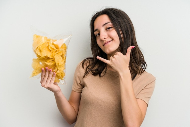 Showing a mobile phone call gesture with fingers