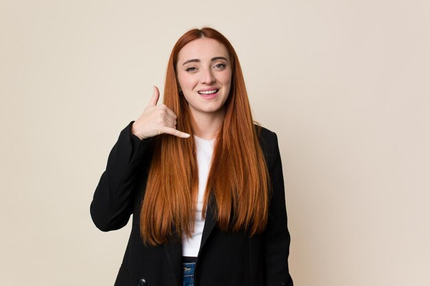 Photo showing a mobile phone call gesture with fingers