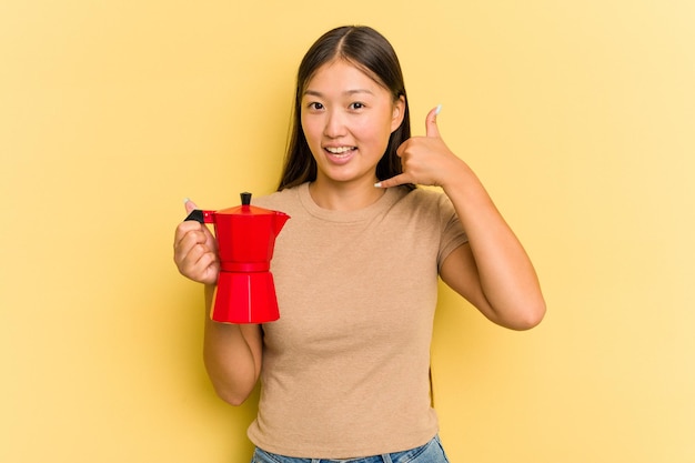 Showing a mobile phone call gesture with fingers