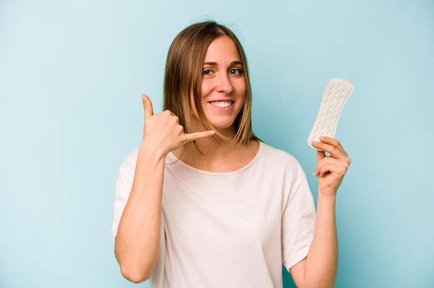 Showing a mobile phone call gesture with fingers