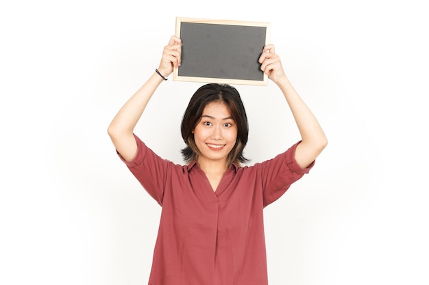 Photo showing presenting and holding blank blackboard of beautiful asian woman isolated on white