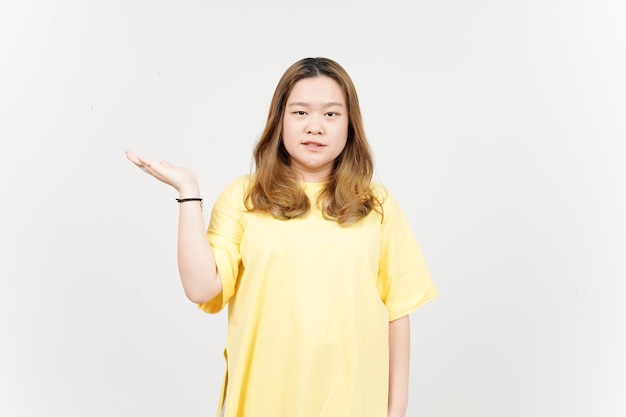 Showing and Presenting Product on Open Palm of Beautiful Asian Woman wearing yellow TShirt