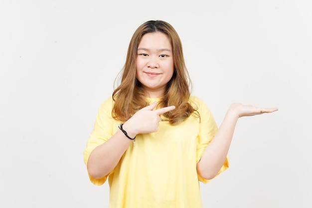 Showing and Presenting Product on Open Palm of Beautiful Asian Woman wearing yellow TShirt