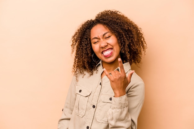 Showing rock gesture with fingers