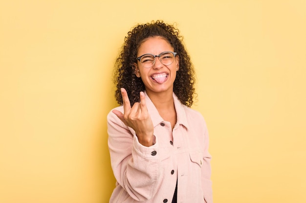 Showing rock gesture with fingers