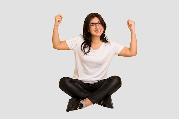 Showing strength gesture with arms symbol of feminine power