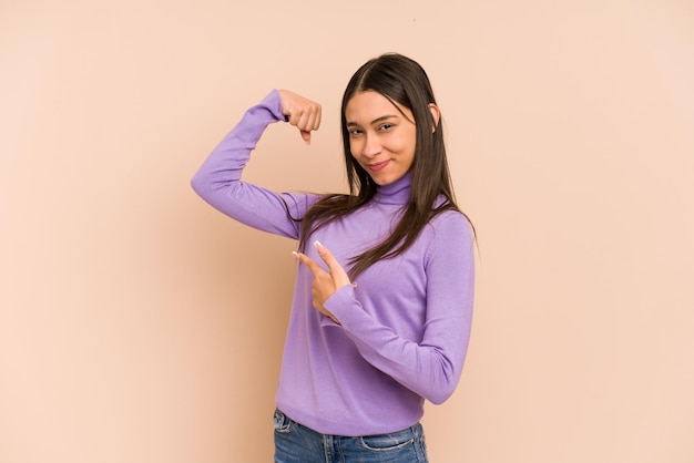 Showing strength gesture with arms symbol of feminine power