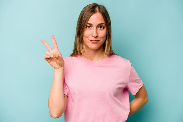 Showing victory sign and smiling broadly