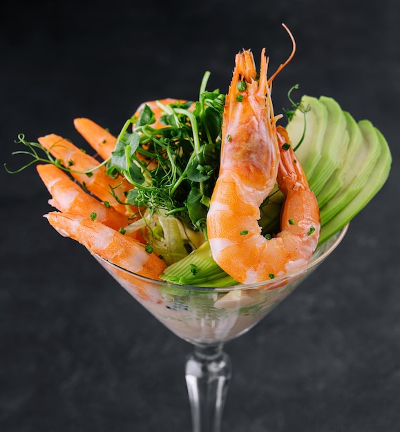 Shrimp and avocado pieces in a martini glass