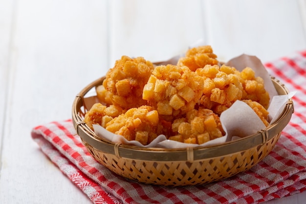 Shrimp balls covered with breaded fried on the white wooden surface.