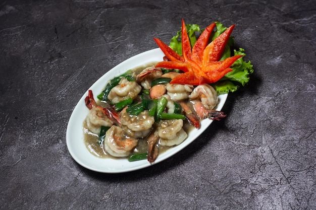 Shrimp Garlic and Pepper served in dish isolated on grey background top view of indian and bangladesh food