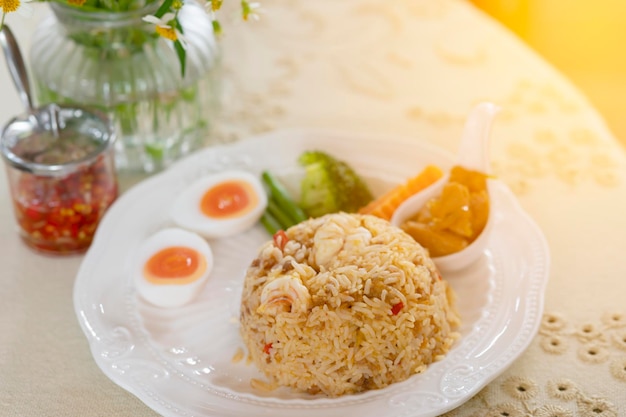 Shrimp paste chili paste fried rice with fresh boiled egg on food and drink concept