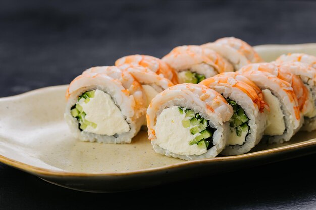 Photo shrimp sushi rolls philadelphia with creamy filling and cucumber japanese cuisine themes