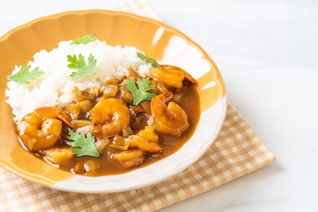 Shrimps in curry sauce on rice