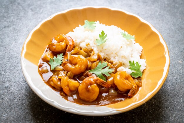 Shrimps in curry sauce on rice