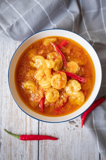 Shrimps curry with chilli in a white plate