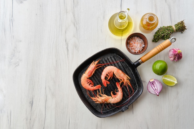 Shrimps in frying pan and spices