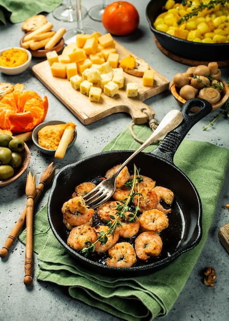 Shrimps roasted on frying cast iron pan