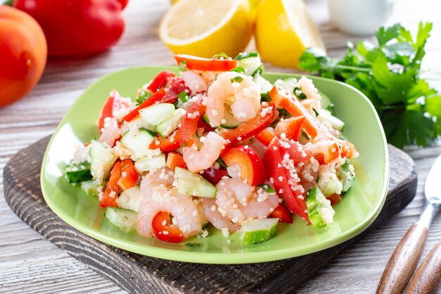 Shrimps with couscous and vegetables, healthy salad