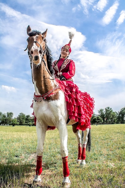 Shymkent Kazakhstan May 16 2018 A holiday at the city hippodrome in honor of the beginning of the Holy month of Ramadan Girls in national costumes on horseback