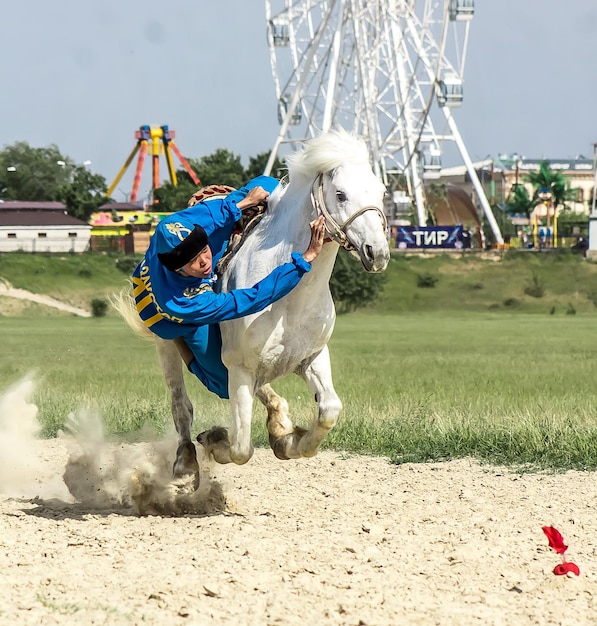 Shymkent Kazakhstan May 16 2018 A holiday at the city racetrack in honor of the beginning of the Holy month of Ramadan Riders in national costumes on horseback