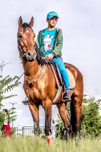 Shymkent Kazakhstan May 16 2018 A holiday at the city racetrack in honor of the beginning of the Holy month of Ramadan Riders in national costumes on horseback