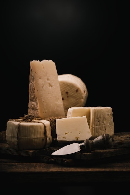 Sicilians cheeses on a black background with a place for text Close upxDxA