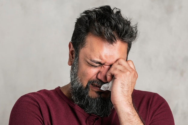 Sick emotional Indian man crying