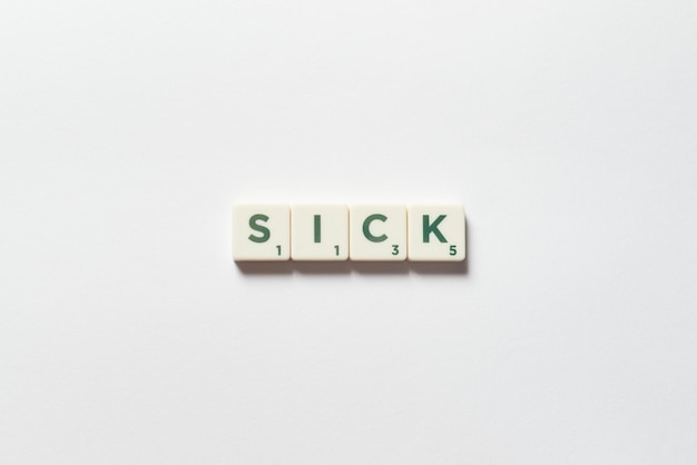 Sick formed of scrabble blocks