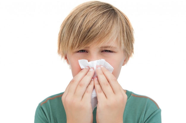 Sick little boy with a handkerchief