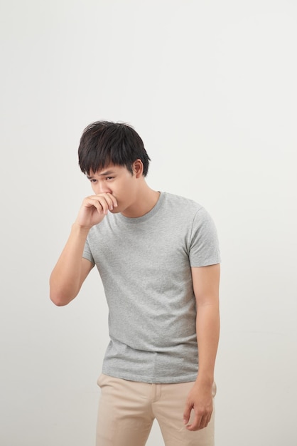 Sick man with runny nose portrait sick asian man with runny nose cold flu illness contagious disease health care concept young adult asian man model