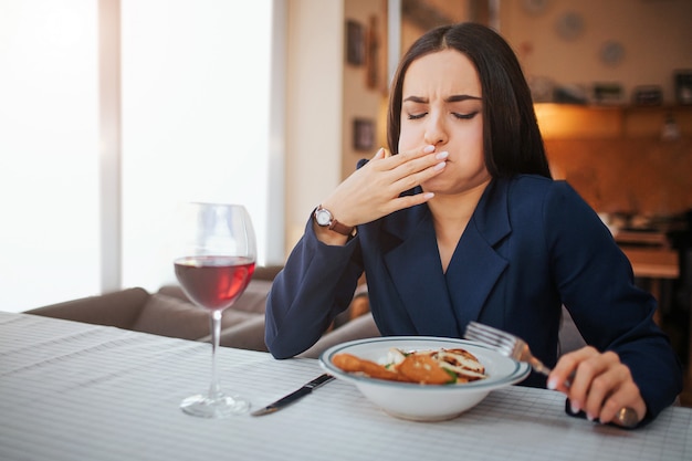 Sick young woman start to vomit