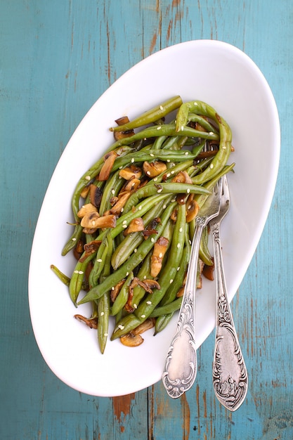 A side dish of beans with mushrooms, garlic and soy sauce