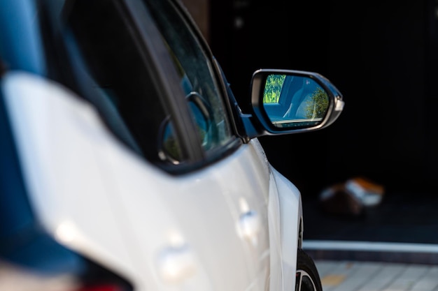 Side rear view mirror on a modern car closeup