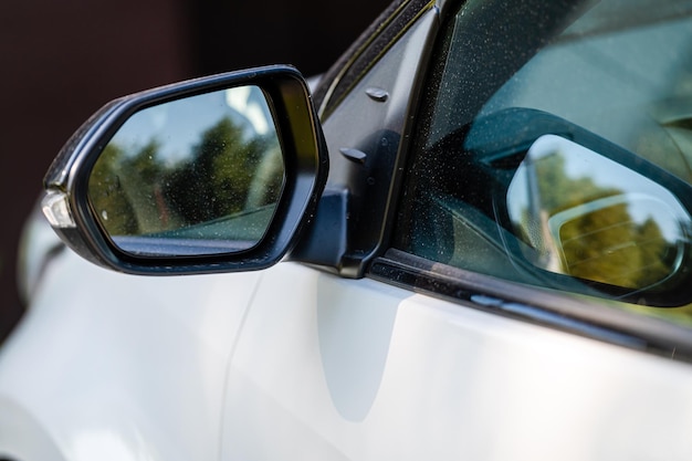 Side rear view mirror on a modern car closeup