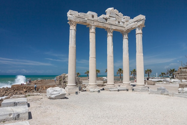 SIDE TURKEY april 19 2012 People explore ancient roman ruins of Apollo temple in Side Turkey