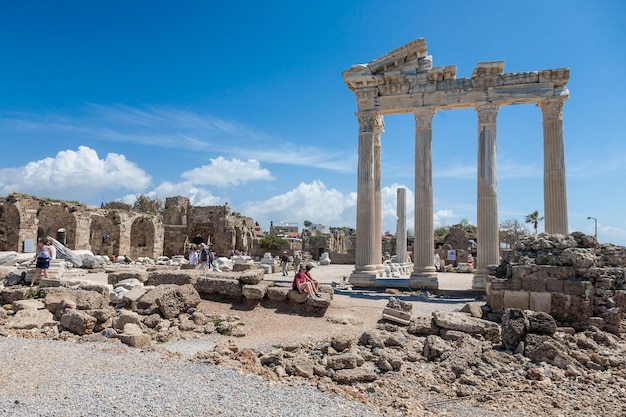 SIDE TURKEY april 19 2012 People explore ancient roman ruins of Apollo temple in Side Turkey