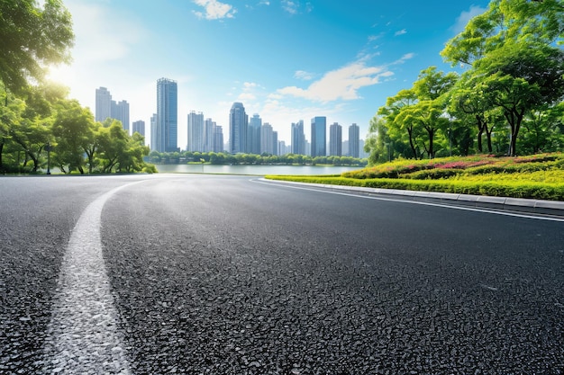 Side view of asphalt road highway with lake garden and modern city skyline in background