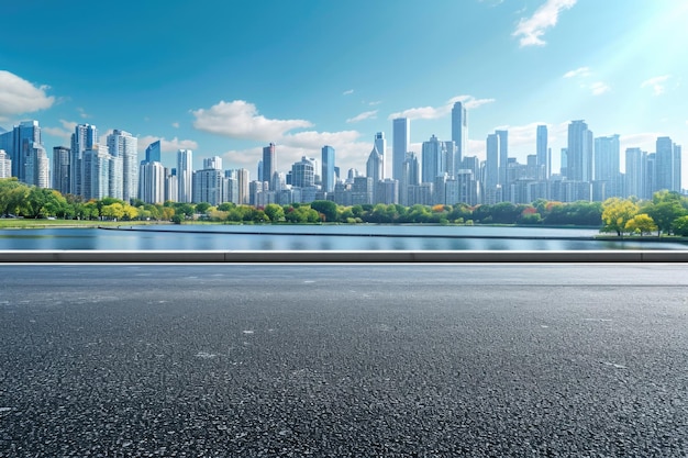 Side view of asphalt road highway with lake garden and modern city skyline in background