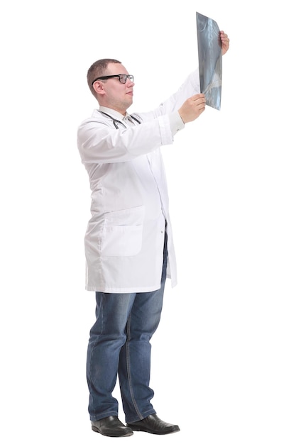 Side view of attractive doctor examining an xray and looking at the camera