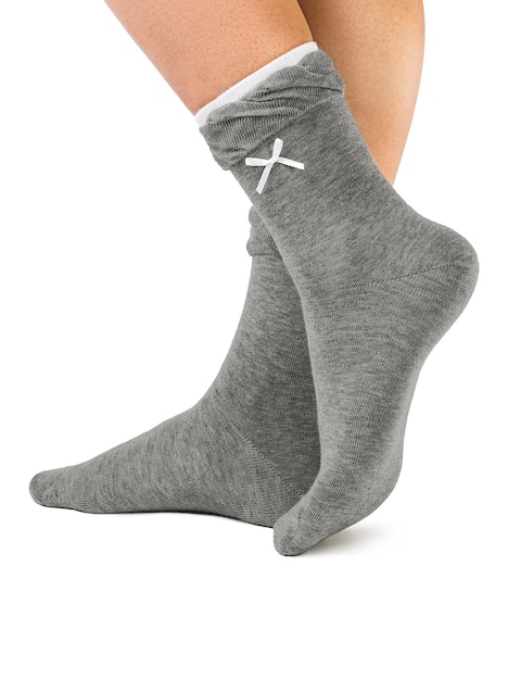 Side view of beautiful woman foot dressed in new nice and soft natural cotton fabric blank grey socks with light grey edging