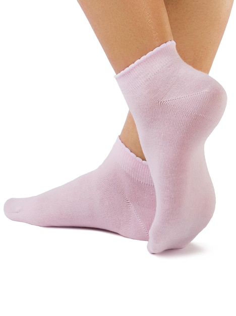 Side view of beautiful woman foot dressed in new nice and soft natural cotton fabric blank pink socks