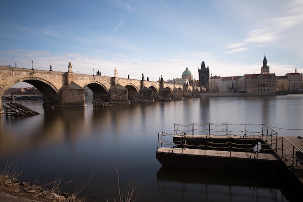 Side view of Charles Bridge in Prague on the banks of the Vltava River