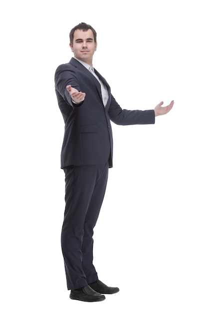 Side view of confident businessman with arms folded against white background